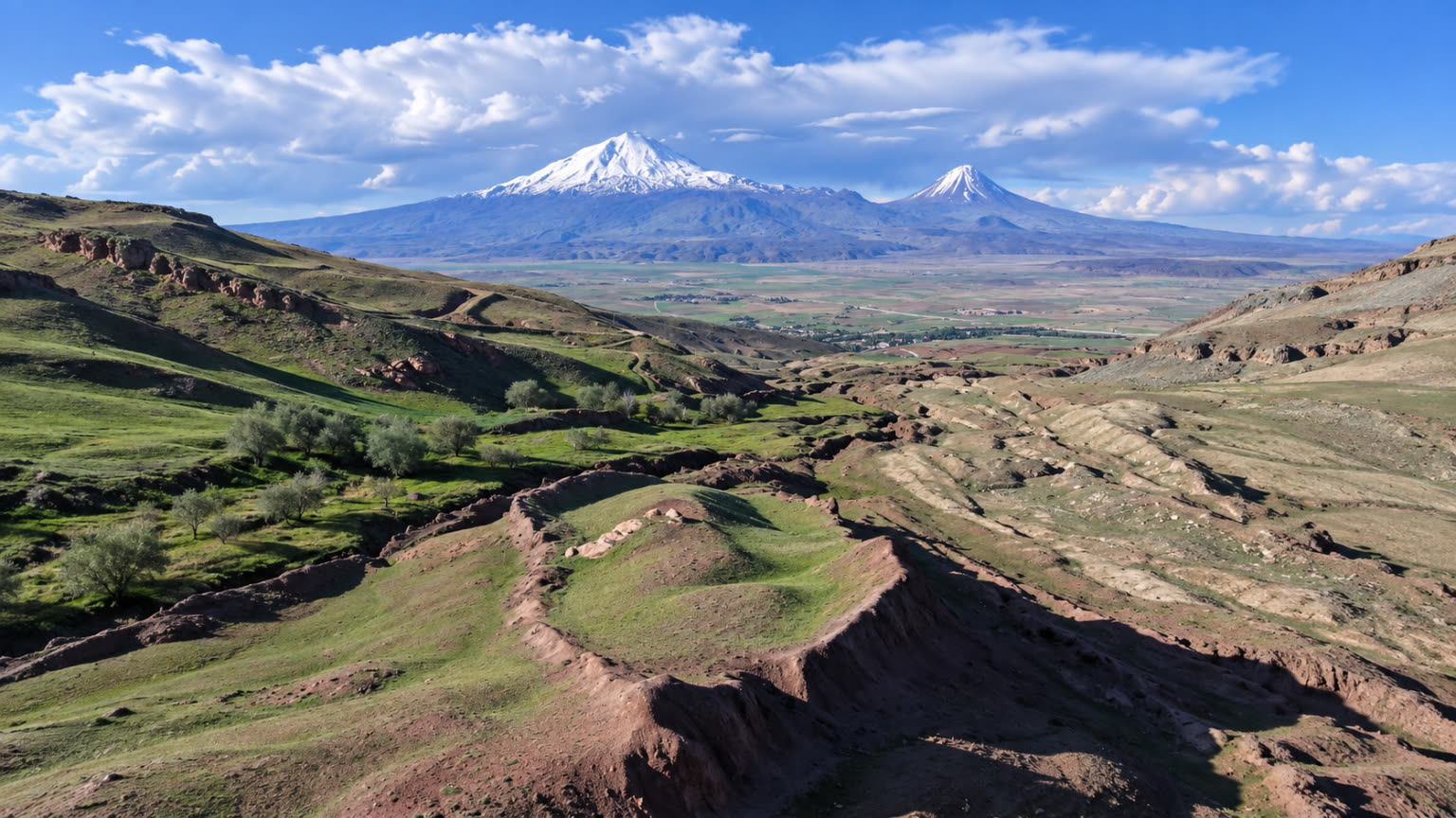 Panorama of the boat-shaped Durupınar formation in green foothills near Mount Ararat.